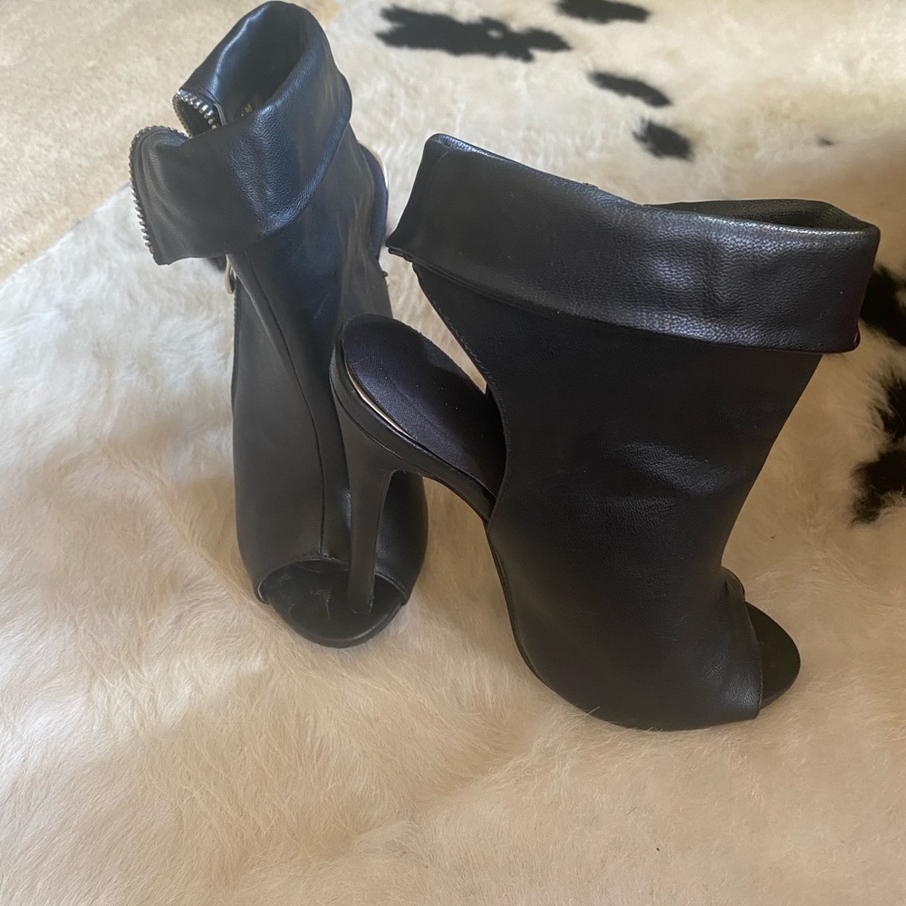 Adorable black high heel bootie, like new, worn very little. Size 6